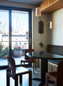  A dining nook features a stunning city view.